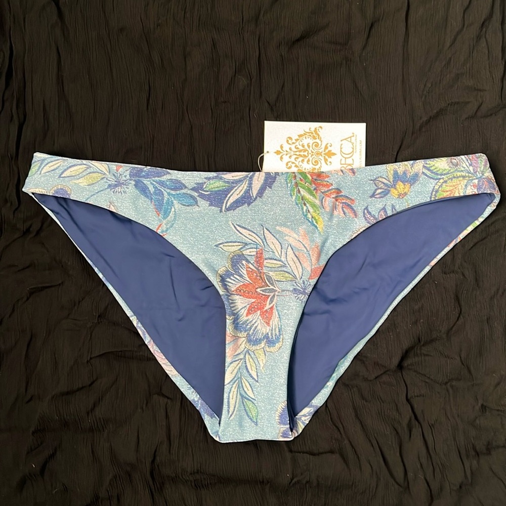 Beautiful BECCA bikini bottom in all over shimmery blue floral print. L
